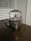 Antique metal engraved teapot with wooden handle