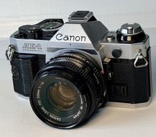  Clean Canon AE-1 Program 35mm SLR Camera FD 50mm f/1.8 Lens Bundle, New Seals