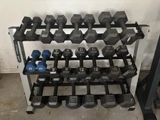 Full Dumbbell Set w/ Racks + Plates, Kettlebells, Barbells. Caption.