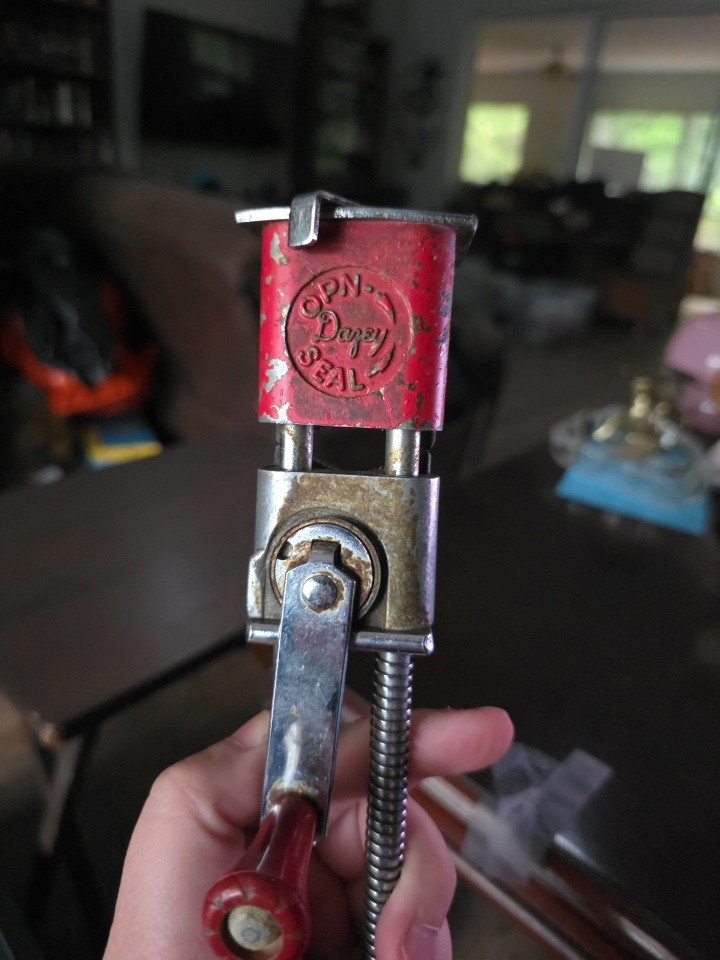 The Dazey Open Seal is a rare, all-metal vintage jar sealer with a striking red finish — a genuine mid-century canning gadget that looks incredible on a shelf.