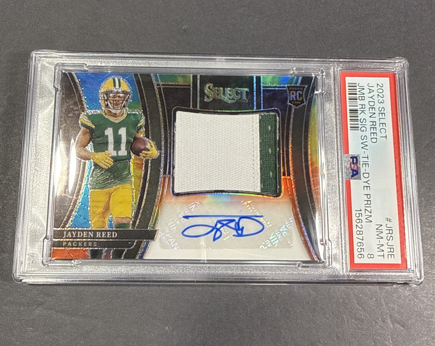 2023 Panini Select - Jayden Reed Rookie Patch Auto #JRS-JRE Tie-Dye /25 PSA 9
