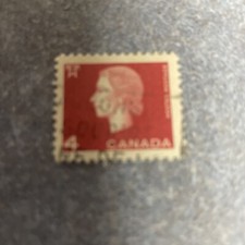 Canada 4 cent stamp with Young Queen  Elizabeth on Red Background Used