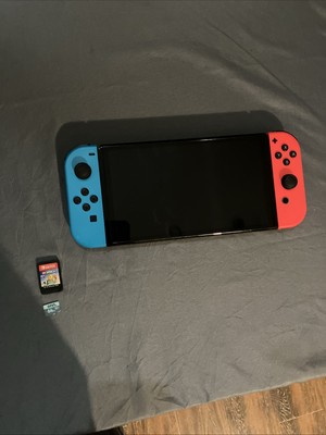 Nintendo switch Oled, broken lcd. Comes with lego worlds, 64 gb sd, free account