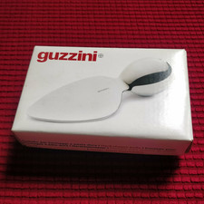 GUZZINI COLTELLO IN ACCIAIO PER FORMAGGIO A PASTA DURA DESIGN DENIS SANTACHIARA