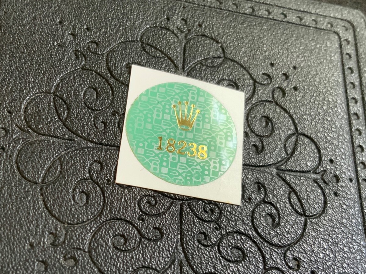 green sticker back of rolex