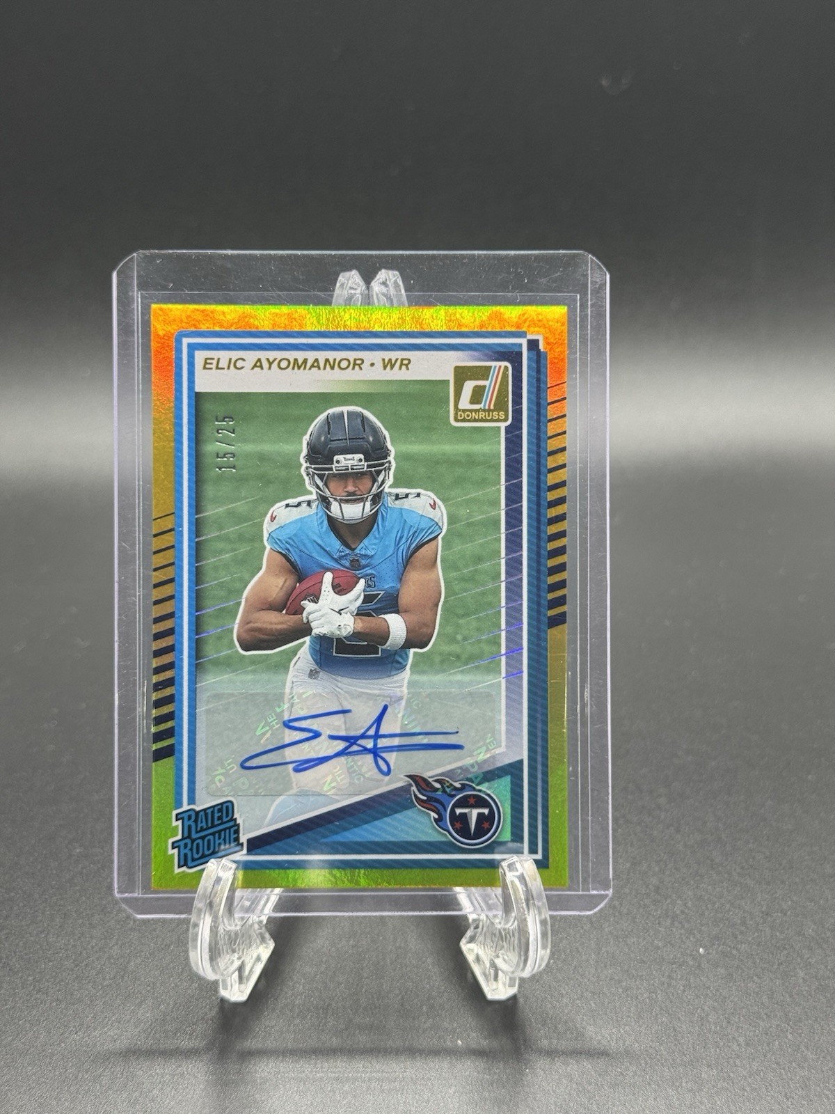 2025 Panini Donruss Rated Rookie Elic Ayomanor Gold Press Proof Auto /25 TITANS
