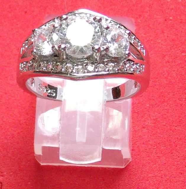 Ladies dinner ring. 3 stones (1) 3/4 ct (2) 1/4 ct + 26 small. sterling size 7 eBay