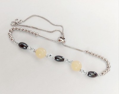 Fußkettchenarmband aus Stahl und Aluminium mit Hämatit und 8 mm gelber Jade