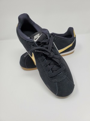 nike cortez se black and gold