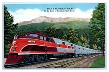 Pikes Peak, CO Postcard-  ROCKY MOUNTAIN ROCKET AT THE FOOT OF FAMOUS PIKES PEAK