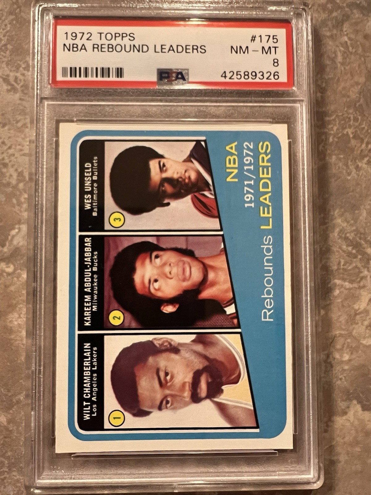 Topps 72-73 - PSA-8 Kareem Abdul-Jabbar, Wilt Chamberlain, Wes Unseld view 1