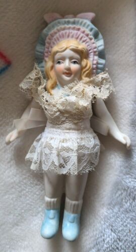 Vintage bisque Porcelain 5.5 in doll with string jointed arms fixed legs bonnet