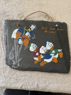 Donald Duck Getting Is Ducks In Line, Hey, Dewie & Louie Hand Drawn On A Slate.