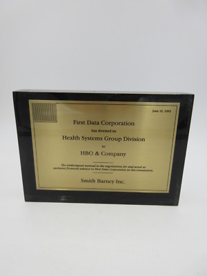 FIRST DATA CORP divested its HEALTH SYSTEMS GROUP TO HBO & CO LUCITE TOMBSTONE