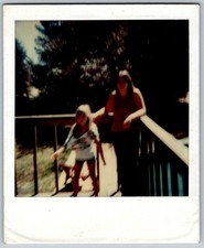 Vtg Polaroid Snapshot Photo Girl Woman Standing Outdoor Wooden Deck 1970s