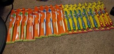 18 Brand new toothbrushes 9 Kids And 9 Adult Soft Bristle. Assorted Colors
