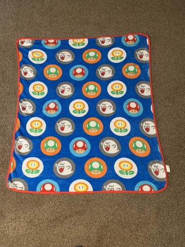 Super Mario World ‘Mushrooms, Fire Plants, and Boos’ Blue Throw Blanket