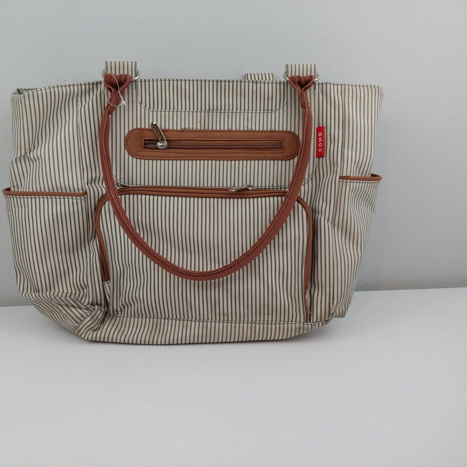 Soho 18-inch diaper bag in brown and green stripes with changing pad-image