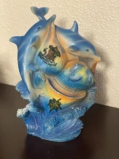 Two Blue Dolphins Swimming Around Three Baby Dolphins Figurine