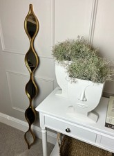 Image of Gold teardrop statement mirror