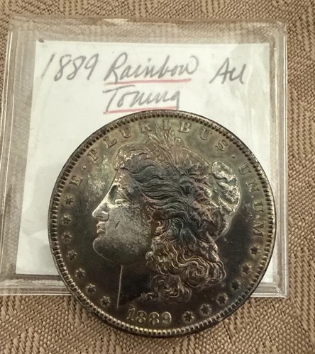 1889 MORGAN SILVER DOLLAR RAINBOW TONED- AU