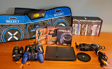 Working PS2 Slim, stand, 2 controllers, 1 mic...