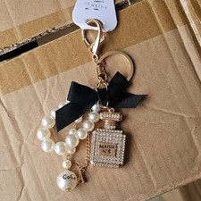 Coco CHANEL: Pearls, Perfume, and the Little Black Dress Keychain