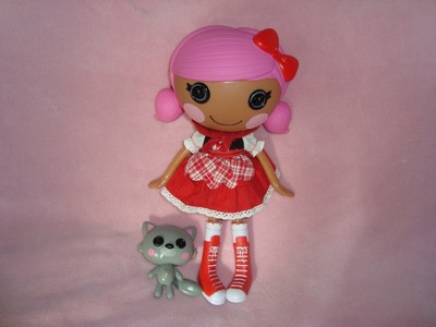 doll with button eyes and pink hair