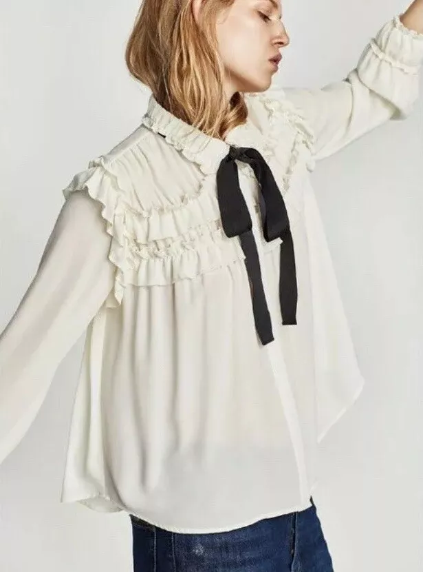 Black and white sales ruffle blouse