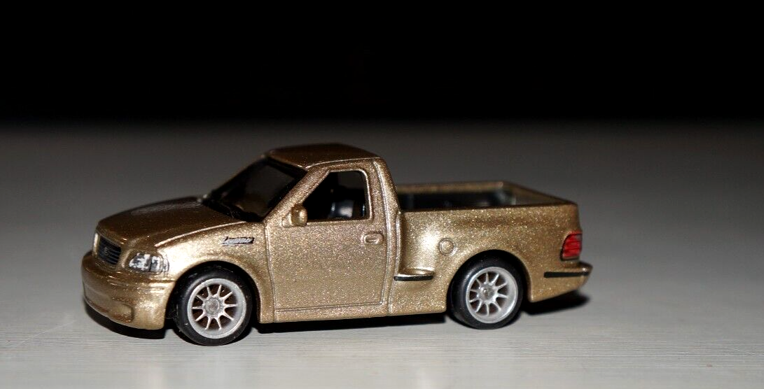 1999 Ford Lightning SVT with Custom Wheels & Real Riders Tires 1/64 Scale-image