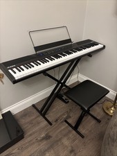 88-key Digital Piano Keyboard Set With An Adjustable Seat And A Sustain Pedal