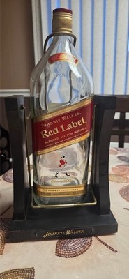1.75-lt bt Johnnie Walker Red in a wooden tilting in a traditional wood cradle