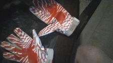 red and white underarmour football gloves newly used works