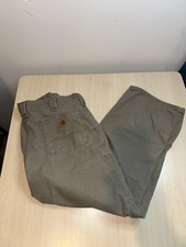 Carhartt B151 loose fit canvas utility work pants in a green/tan color.