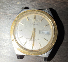 Lorus Quartz Analog Day/Date Wristwatch Silver Dial Gold Bezel SS Black