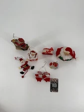 A collection of assorted vintage Santa Claus Christmas ornaments lot of 8 