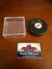 Danny DeKeyser #65 Autographed Detroit Red Wings Hockey Puck