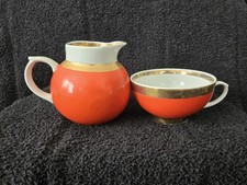 CTKPO Duelvo Porcelain Orange Creamer and Cup Gold Trim Soviet Ceramics