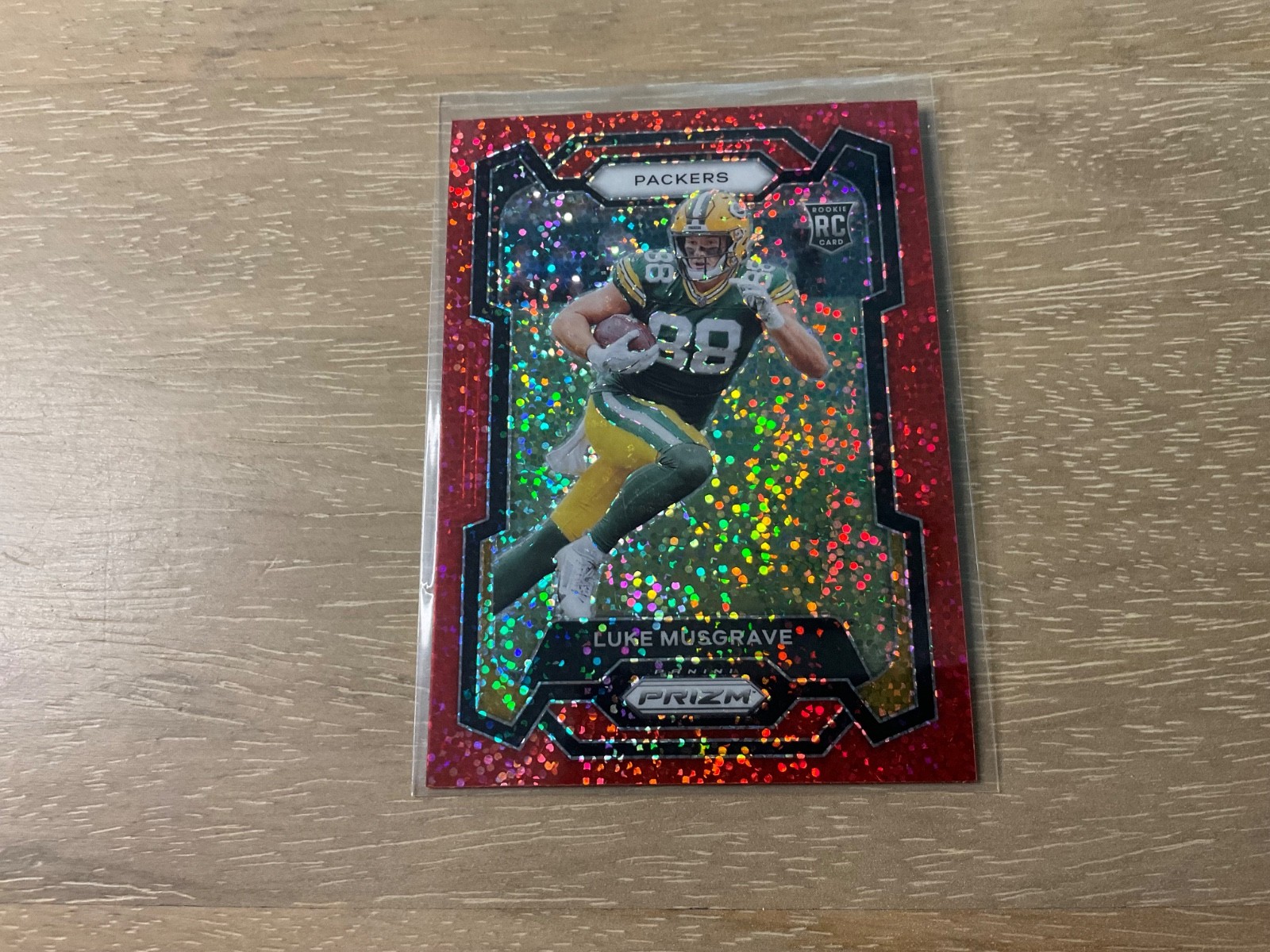 2023 Panini Prizm Football Luke Musgrave Red Sparkle Prizm Rookie #337 Packers