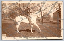 Antique RPPC man riding horse in park Real Photo Postcard 
