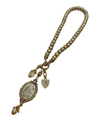 ROBIN STEELE                    Gold-colored necklace