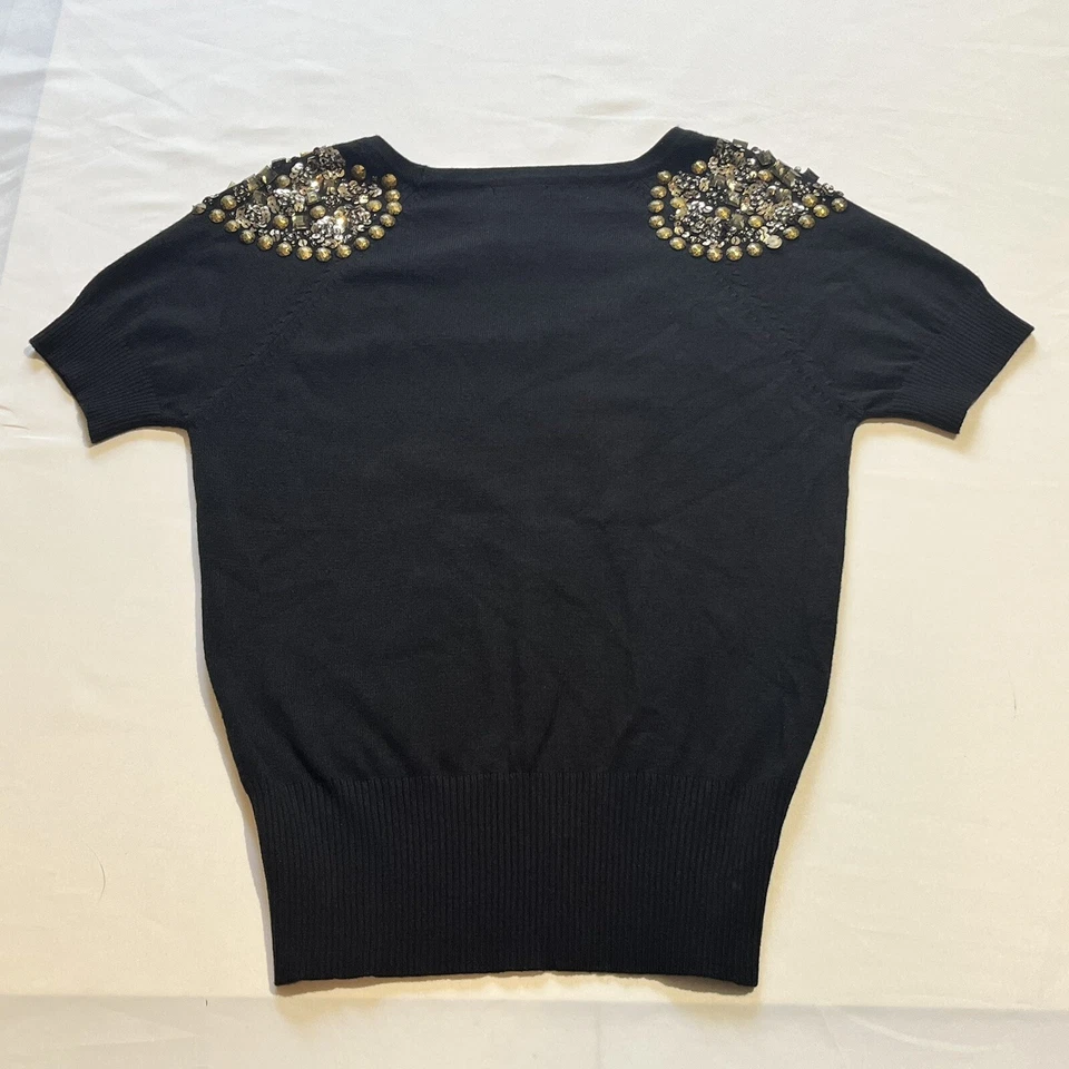 Top suéter de manga corta con cuello redondo y lentejuelas negras bebe para mujer Foto 2 de 4