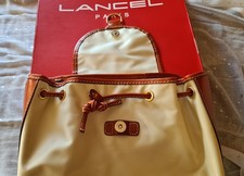 SAC A DOS LANCEL TOILE ENDUITE CERNE DE CUIR TRES BON ETAT