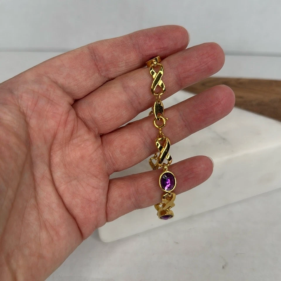 Pulsera para mujer Avon oro y morado Foto 2 de 4