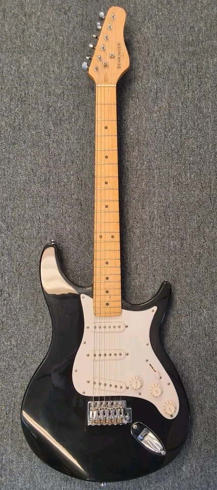 Guitarra eléctrica Behringer de 6 cuerdas de cuerpo sólido de color negro Foto 2 de 4