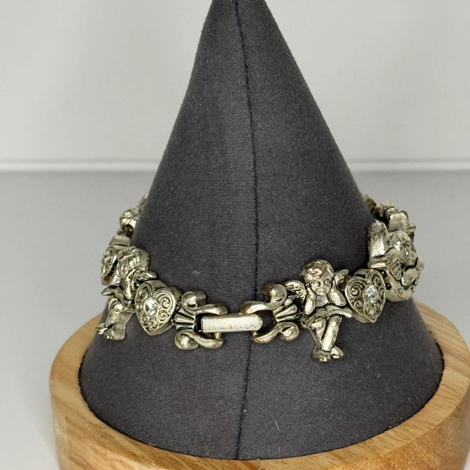 Pulsera de eslabones de ángel querubín Avon corazones diamantes de imitación tono plata Foto 3 de 4