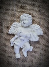 Décoration ange musicien en plâtre brut
