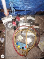 a set of a/c guages and/or manifold gauges. Used for checking the AC unit