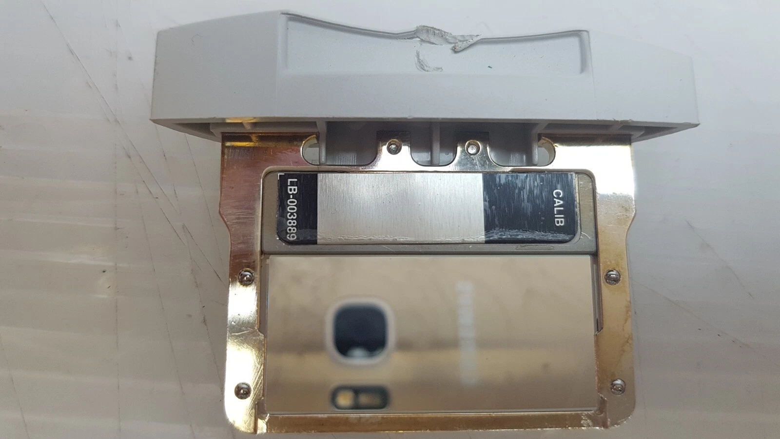 Code strip on the Lumenis filter frame reading LB-003889 and CALIB