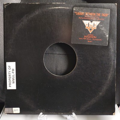 TNT ''Caught Between The Tigers'' 12'' Black Vinyl EP, 1988 Pressing.